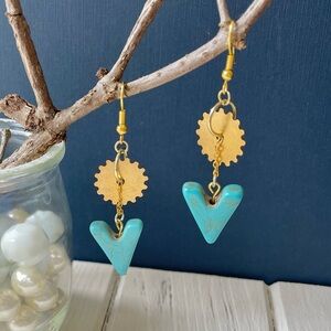 Turquoise stone with gear earring.